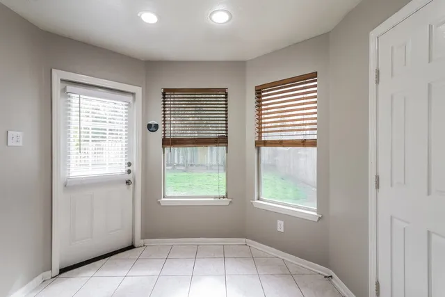 an empty room with windows