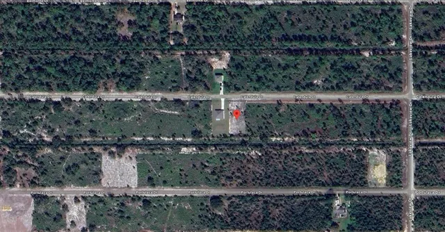 a view of statue in a backyard