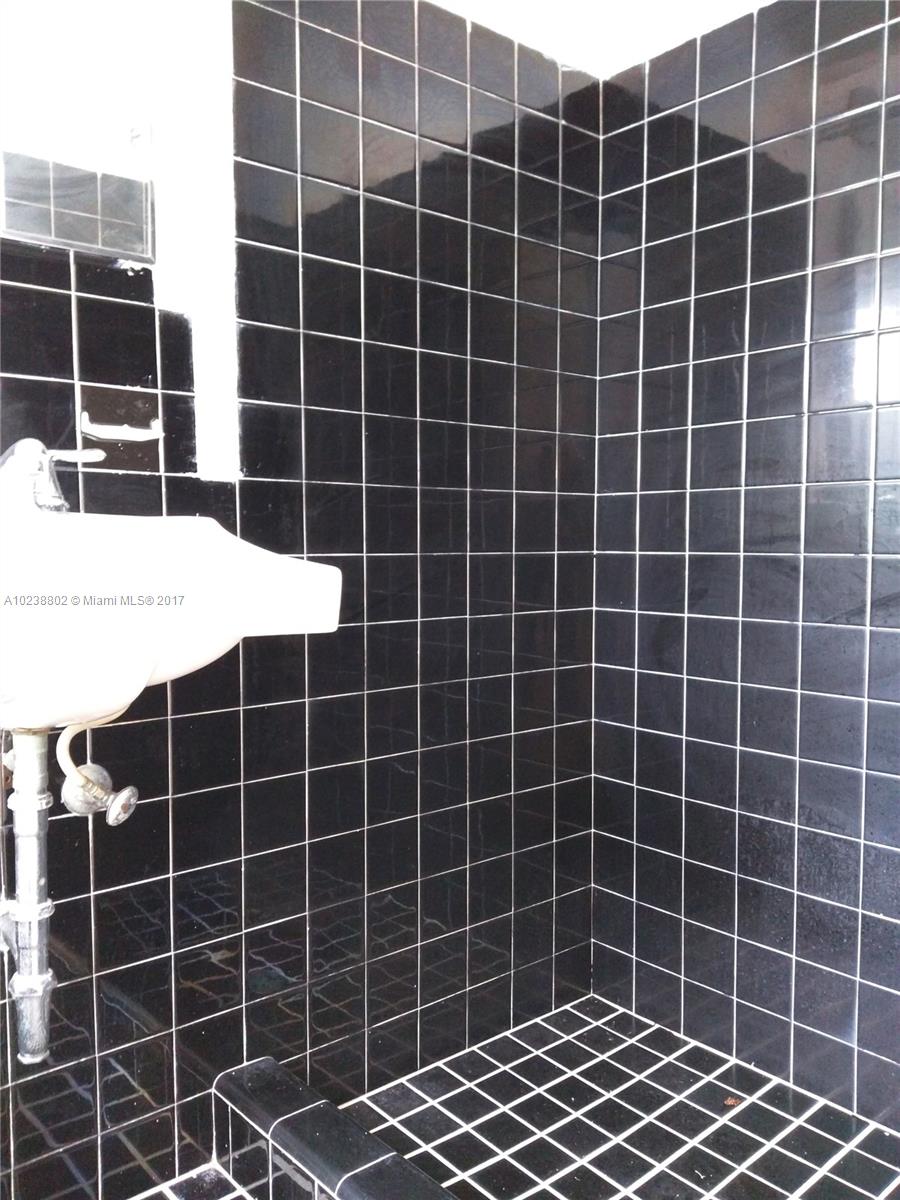 4717 Alton Road Miami Beach, FL 33140 - Photo 15 of 34 a view of a blue building