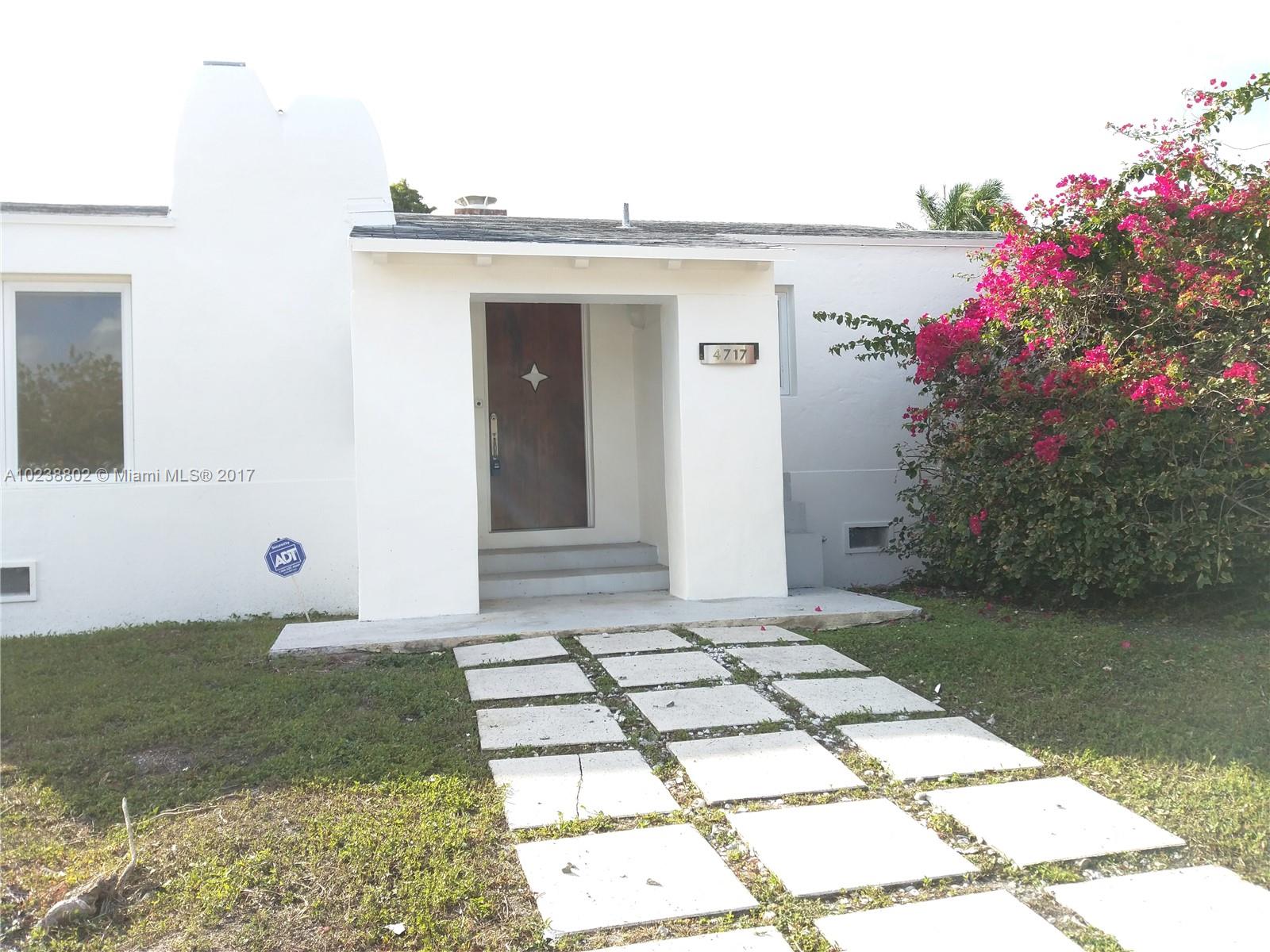 4717 Alton Road Miami Beach, FL 33140 - Photo 17 of 34 a front view of a house with garden