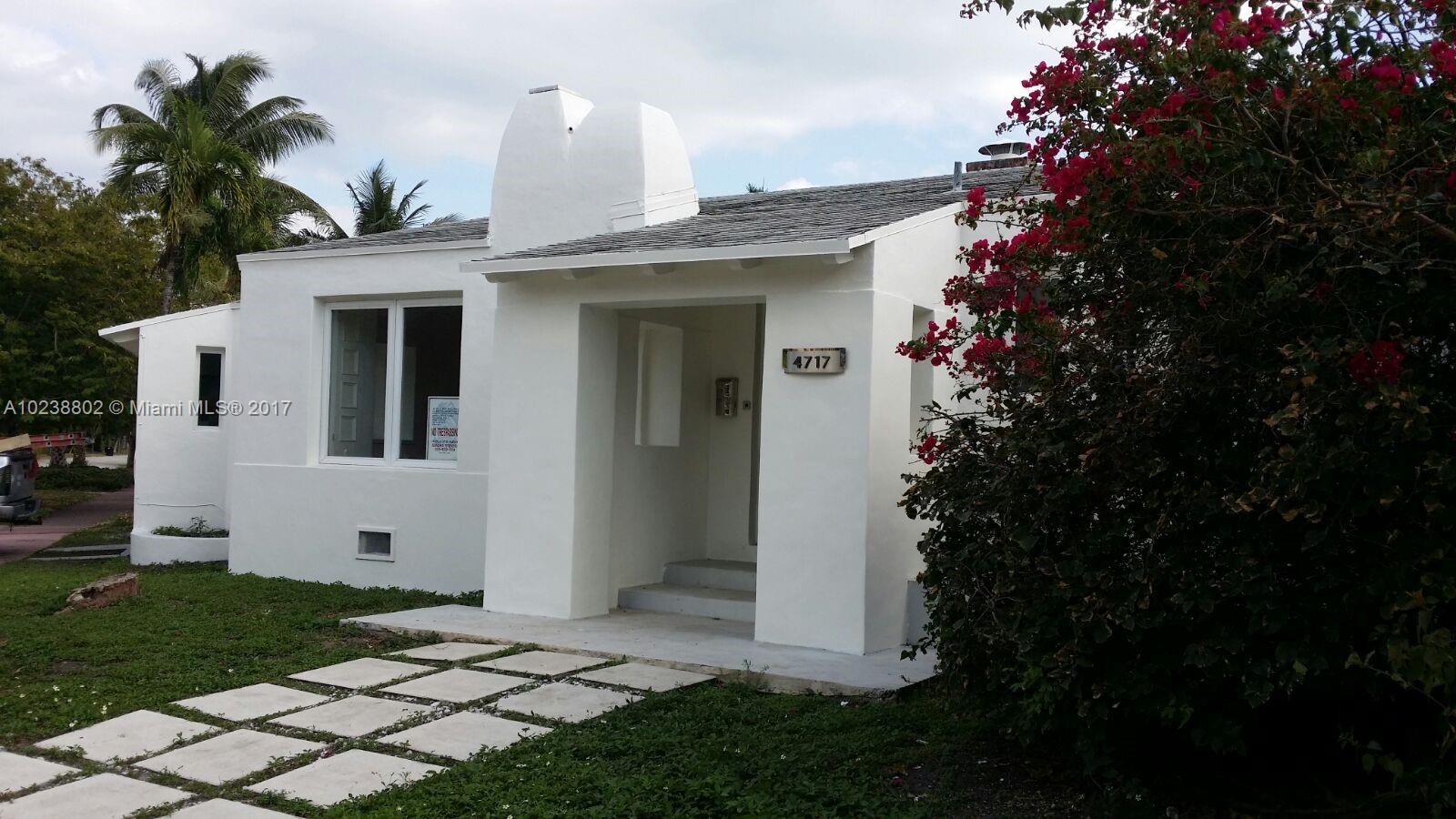 4717 Alton Road Miami Beach, FL 33140 - Photo 2 of 34 a front view of a house with a garden
