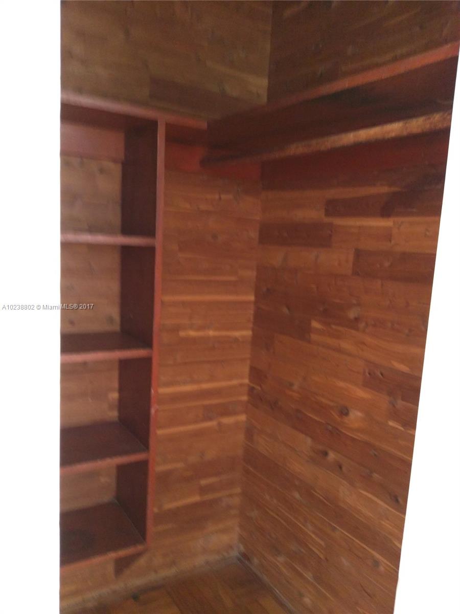 4717 Alton Road Miami Beach, FL 33140 - Photo 23 of 34 a view of walk in closet