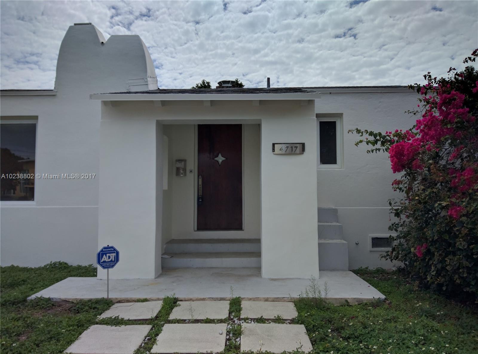 4717 Alton Road Miami Beach, FL 33140 - Photo 28 of 34 a front view of a house with a yard