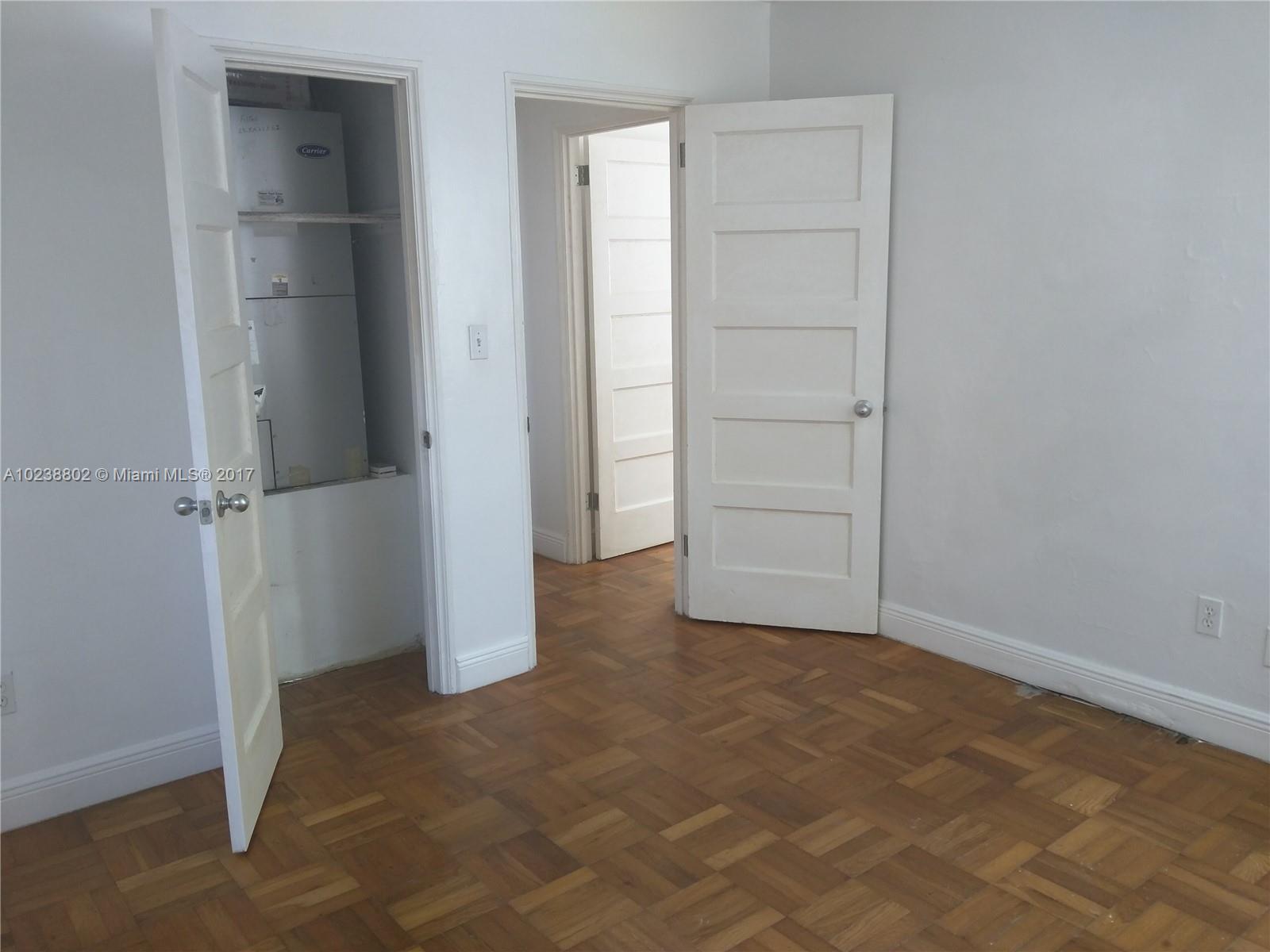 4717 Alton Road Miami Beach, FL 33140 - Photo 29 of 34 an empty room with closet