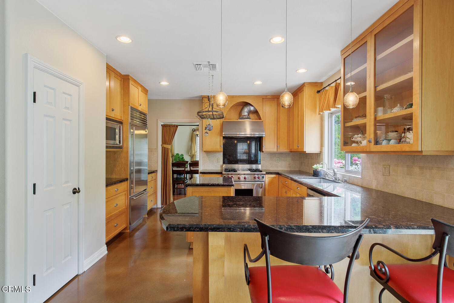 600 Rancho Road Thousand Oaks, CA 91362 - Photo 14 of 47 a kitchen with a table chairs refrigerator and cabinets