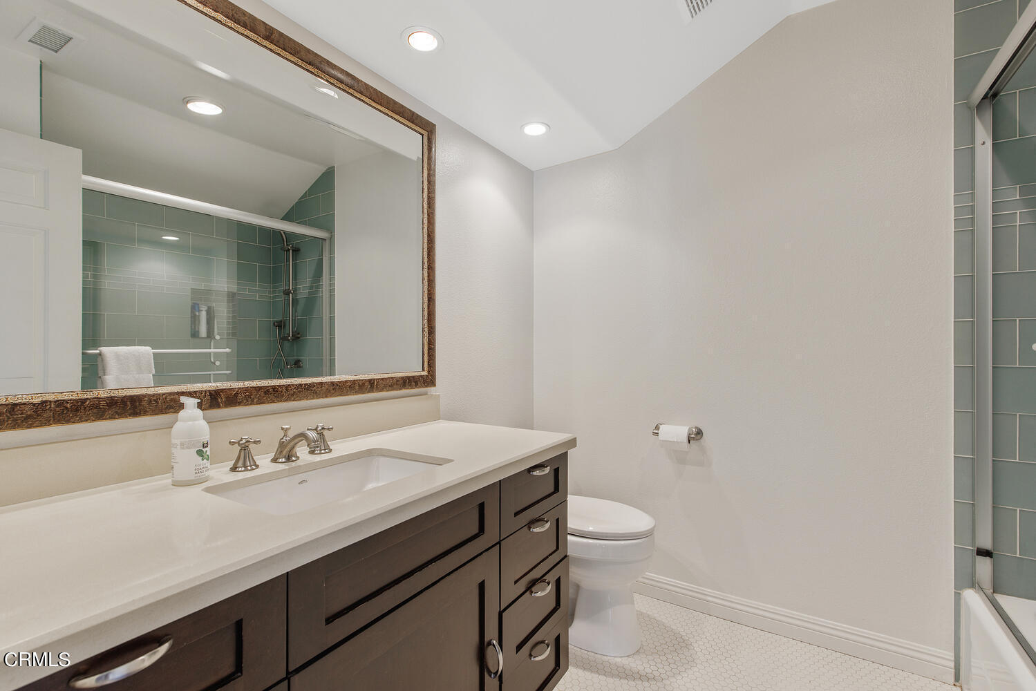600 Rancho Road Thousand Oaks, CA 91362 - Photo 31 of 47 a bathroom with a granite countertop sink a toilet and a mirror