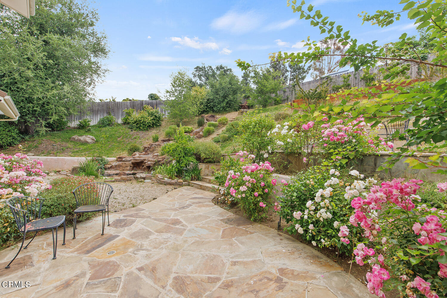600 Rancho Road Thousand Oaks, CA 91362 - Photo 37 of 47 a view of a table and chairs in back yard