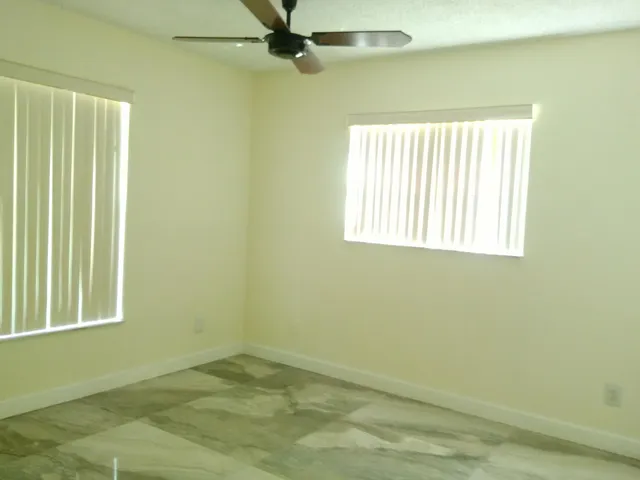 an empty room with windows