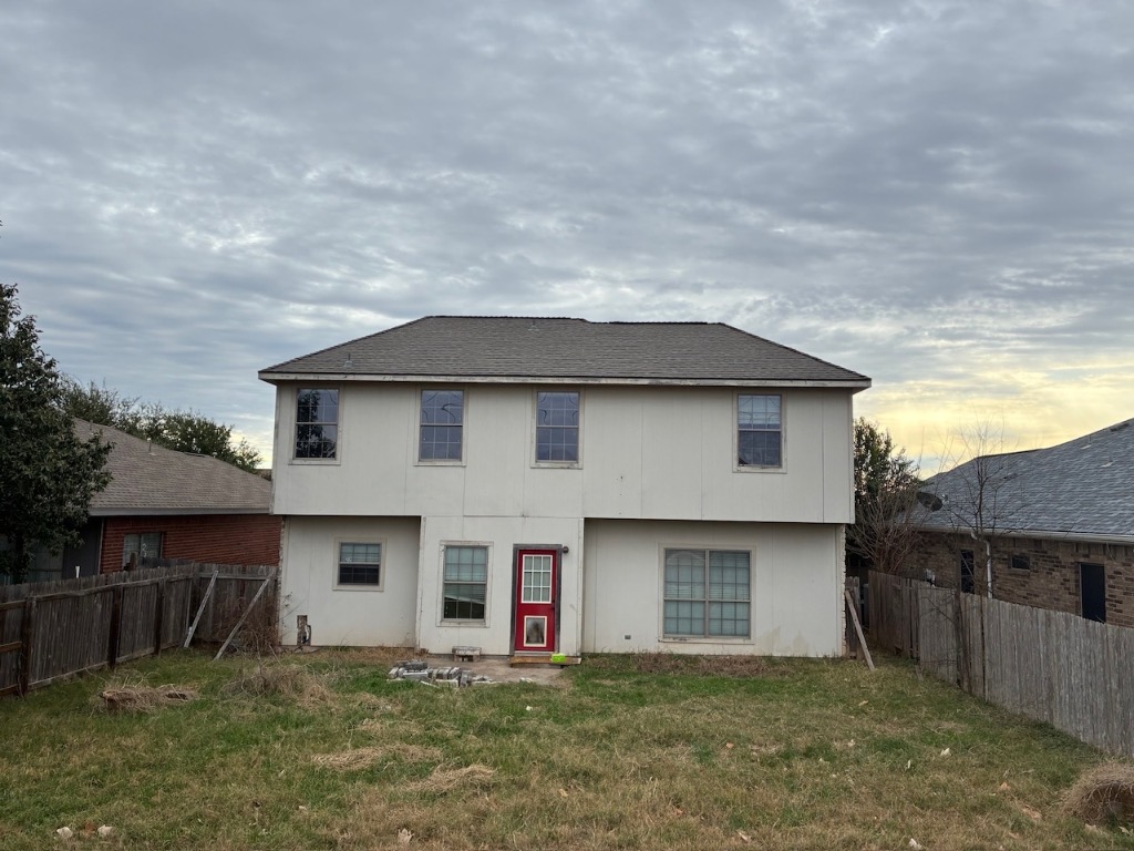 243 Engineers Pass Jarrell, TX 76537 - Photo 2 of 2 Back of house featuring a fenced backyard and a shingled roof