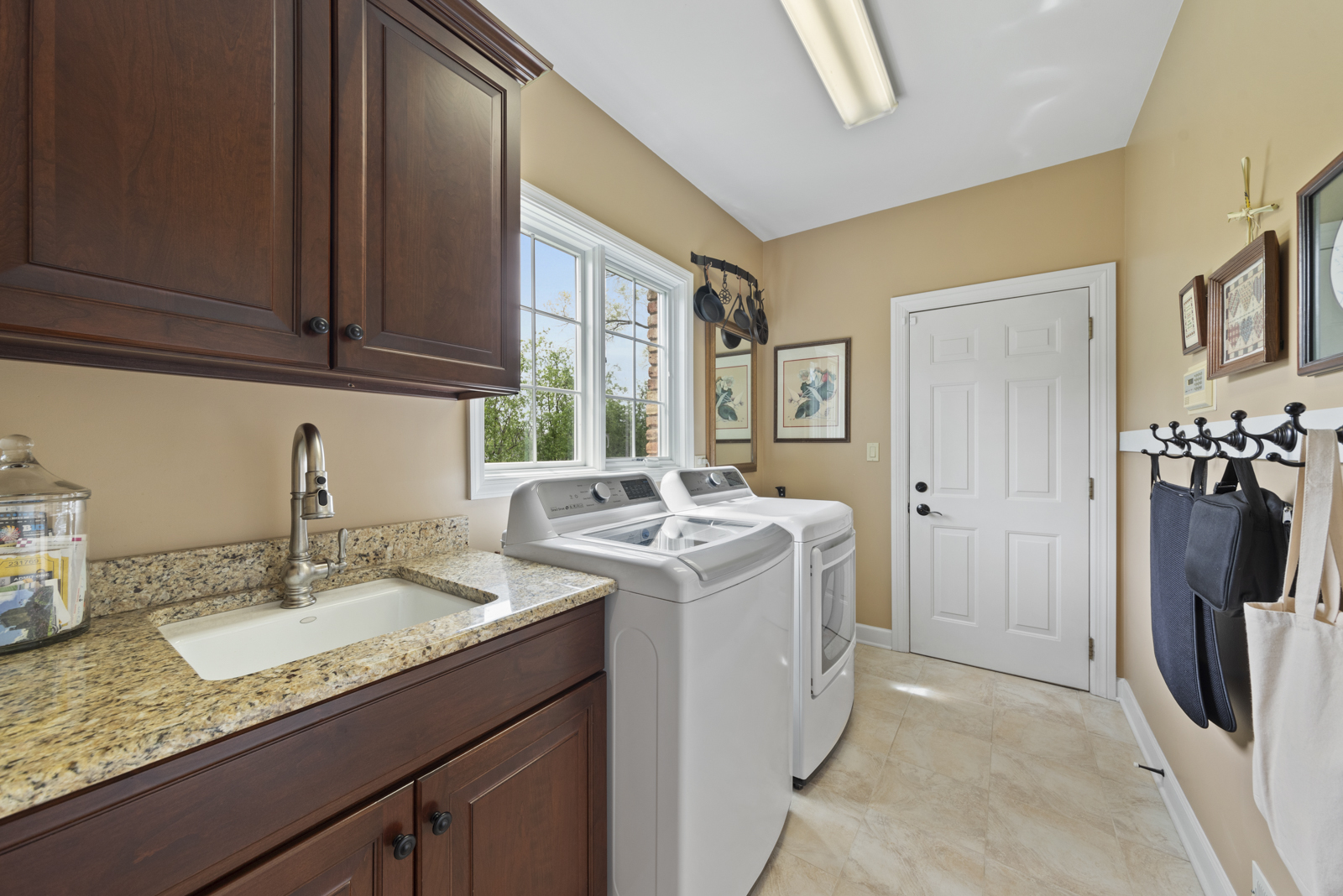 20 Lake Ridge Club Court Burr Ridge, IL 60527 - Photo 15 of 43 a view of a kitchen with a sink dishwasher refrigerator stove and cabinets