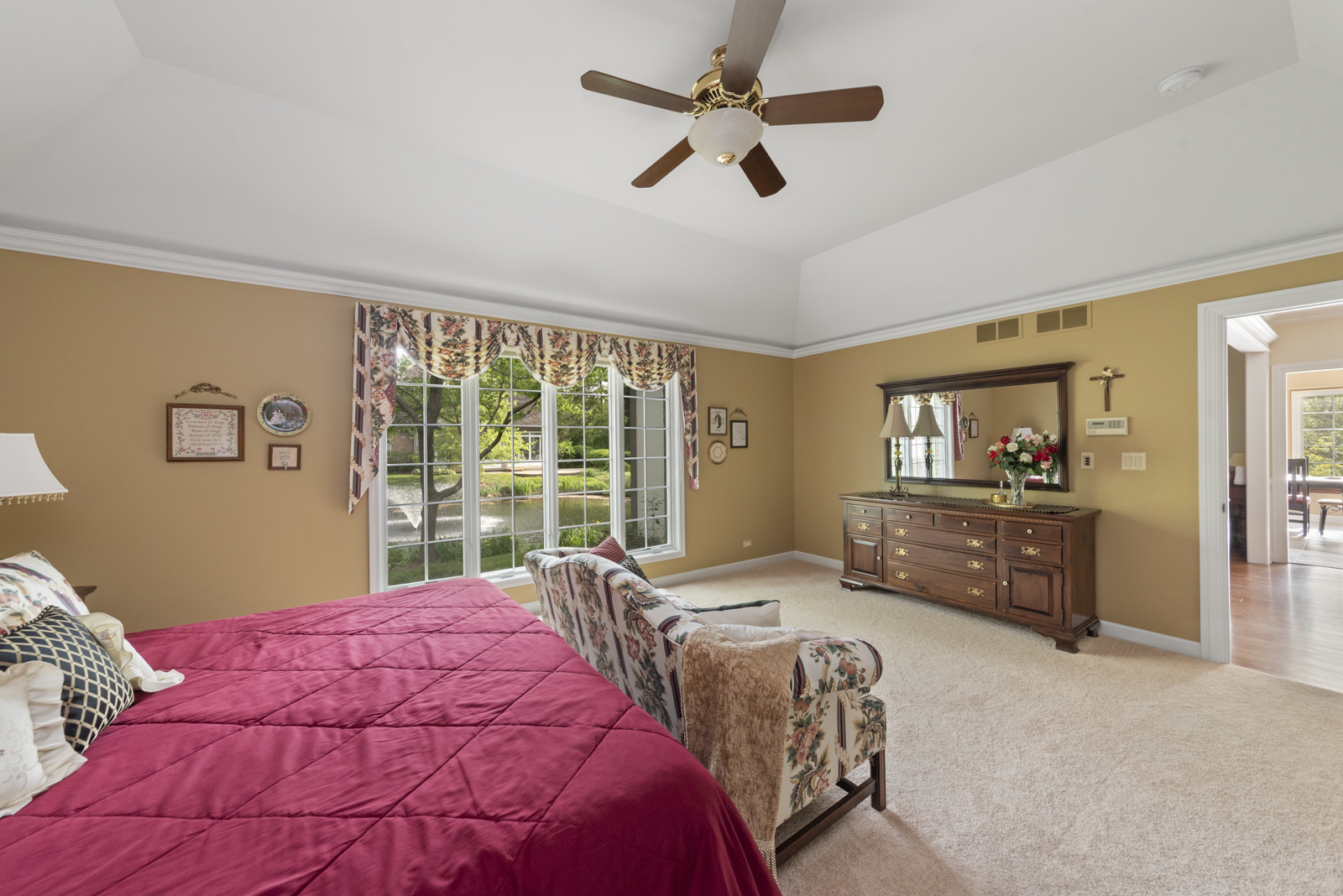 20 Lake Ridge Club Court Burr Ridge, IL 60527 - Photo 19 of 43 a bedroom with a large bed and a window