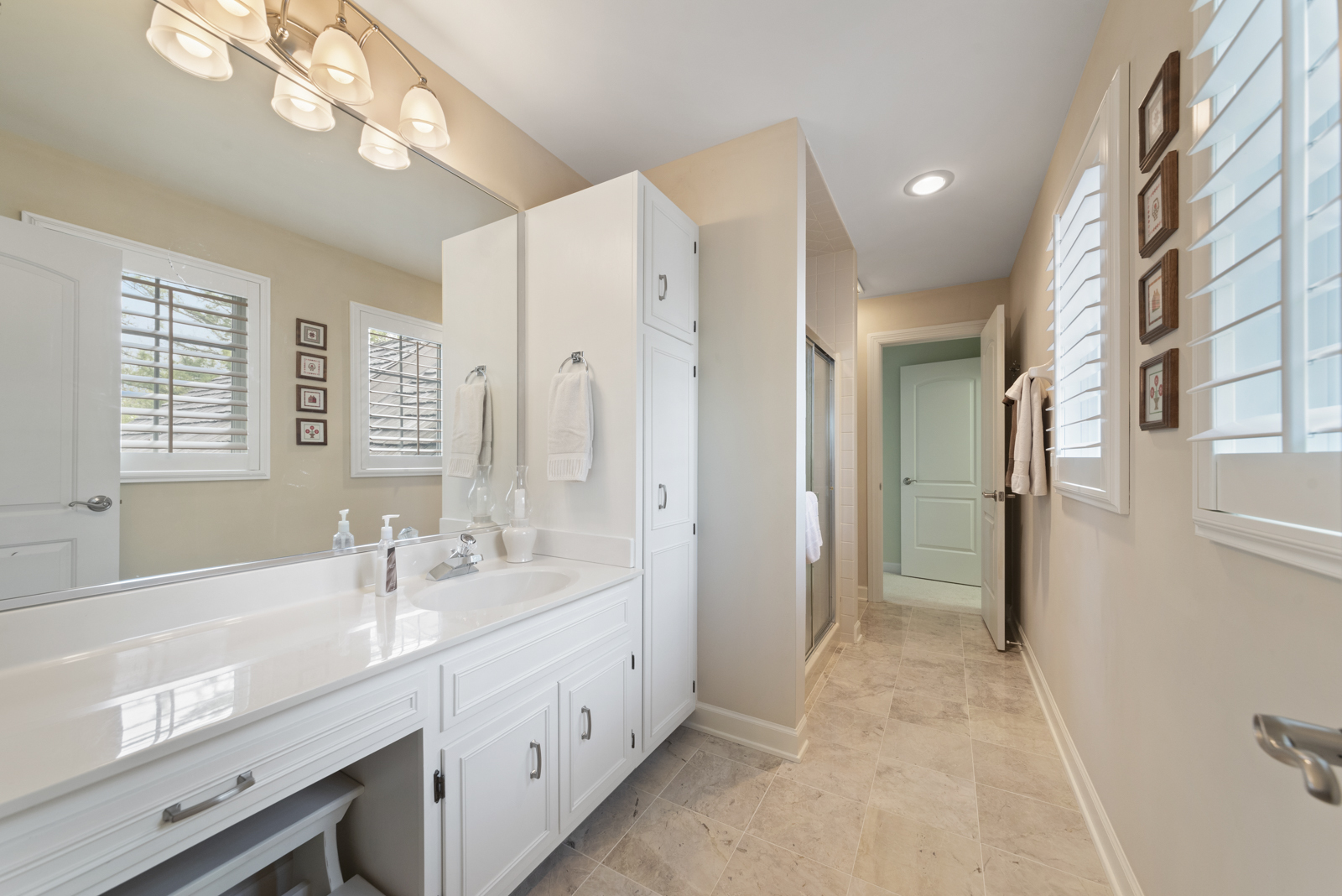 20 Lake Ridge Club Court Burr Ridge, IL 60527 - Photo 24 of 43 a spacious bathroom with a double vanity sink a mirror and a shower
