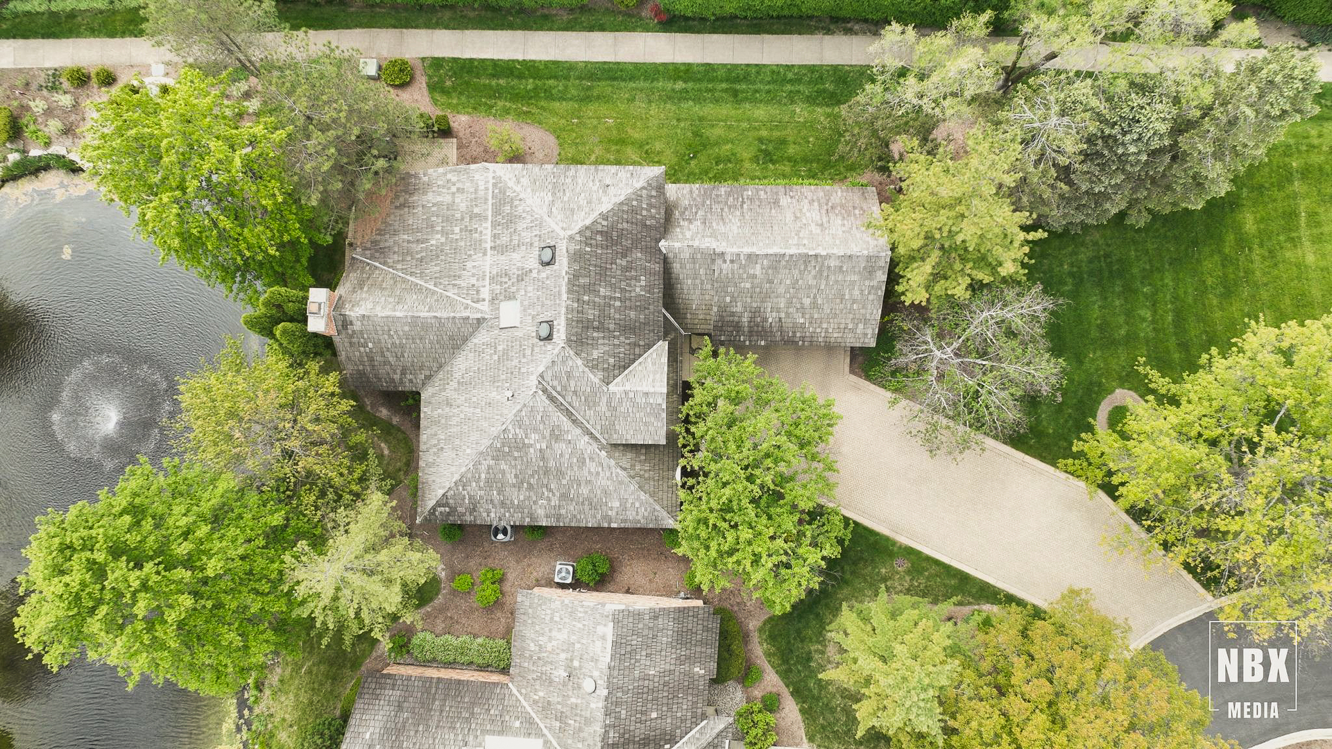 20 Lake Ridge Club Court Burr Ridge, IL 60527 - Photo 36 of 43 an aerial view of a house with a yard and lake view