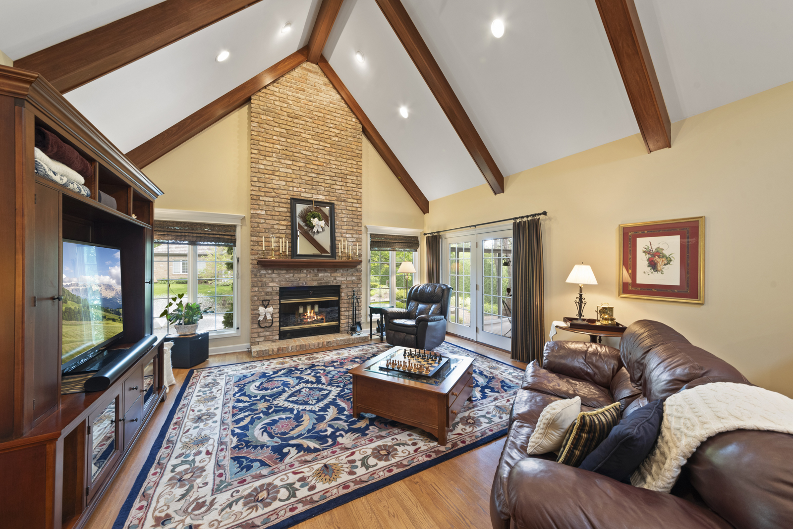 20 Lake Ridge Club Court Burr Ridge, IL 60527 - Photo 5 of 43 a living room with furniture fireplace and flat screen tv