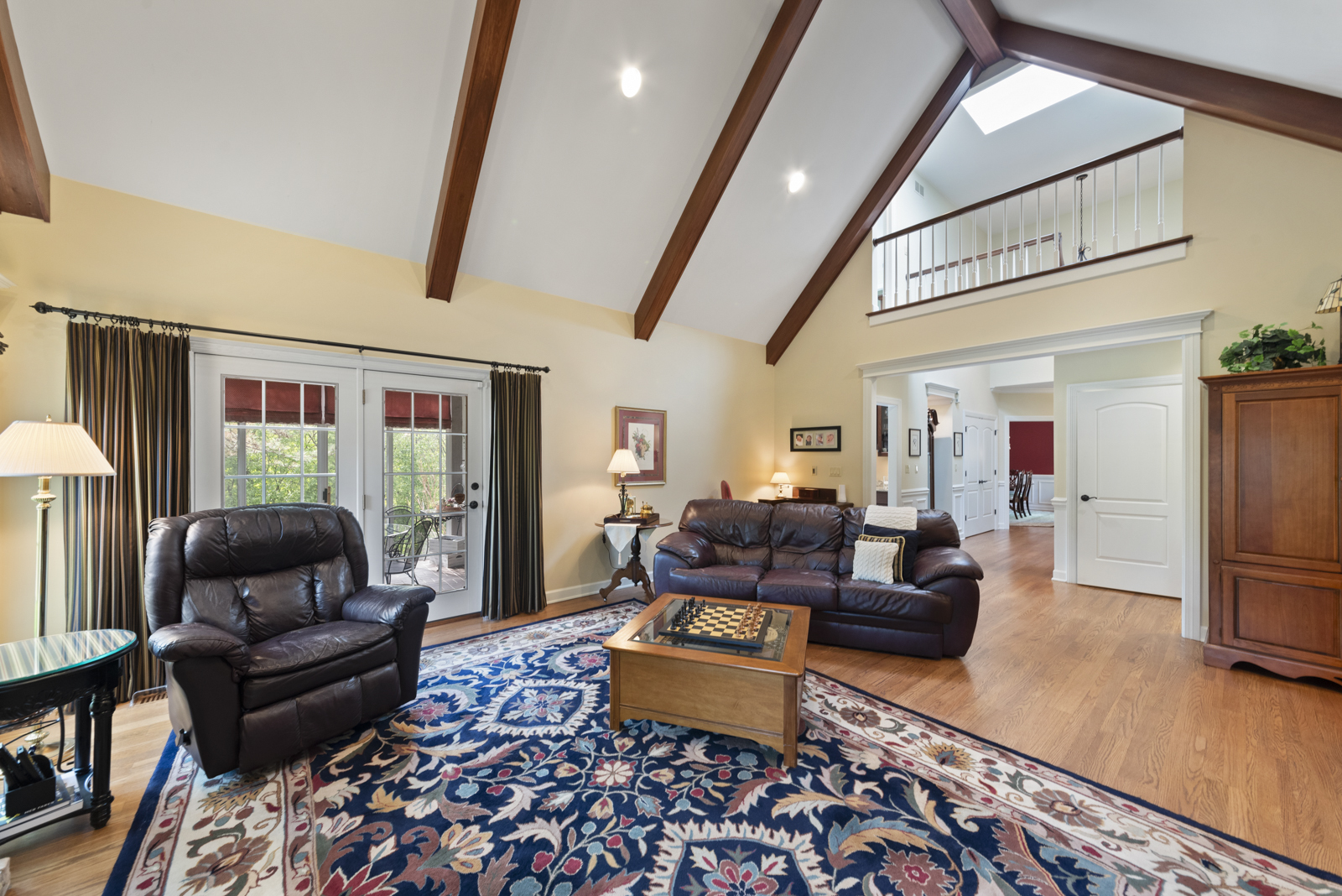 20 Lake Ridge Club Court Burr Ridge, IL 60527 - Photo 6 of 43 a living room with furniture and a flat screen tv