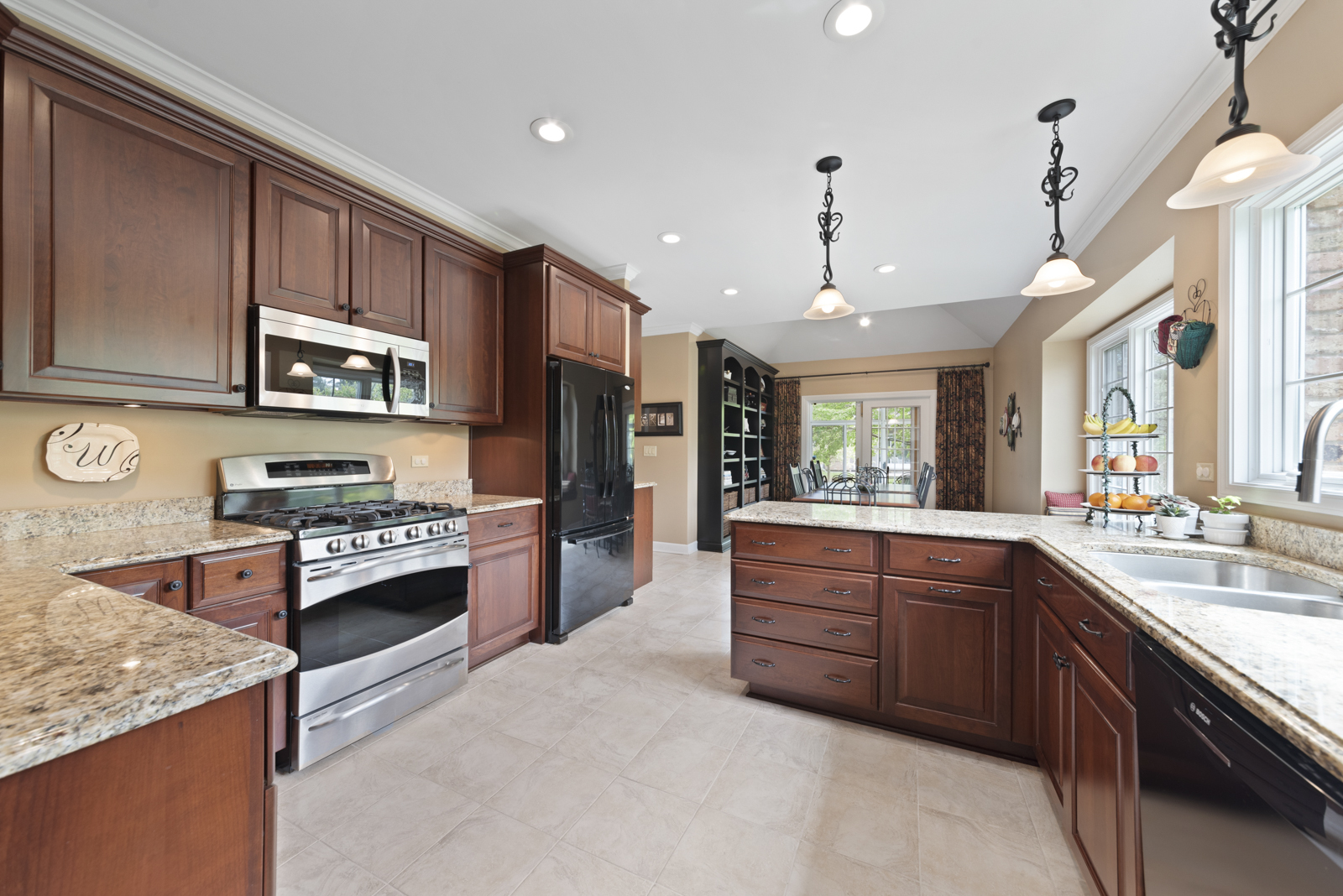20 Lake Ridge Club Court Burr Ridge, IL 60527 - Photo 9 of 43 a large kitchen with stainless steel appliances granite countertop a stove refrigerator and a sink