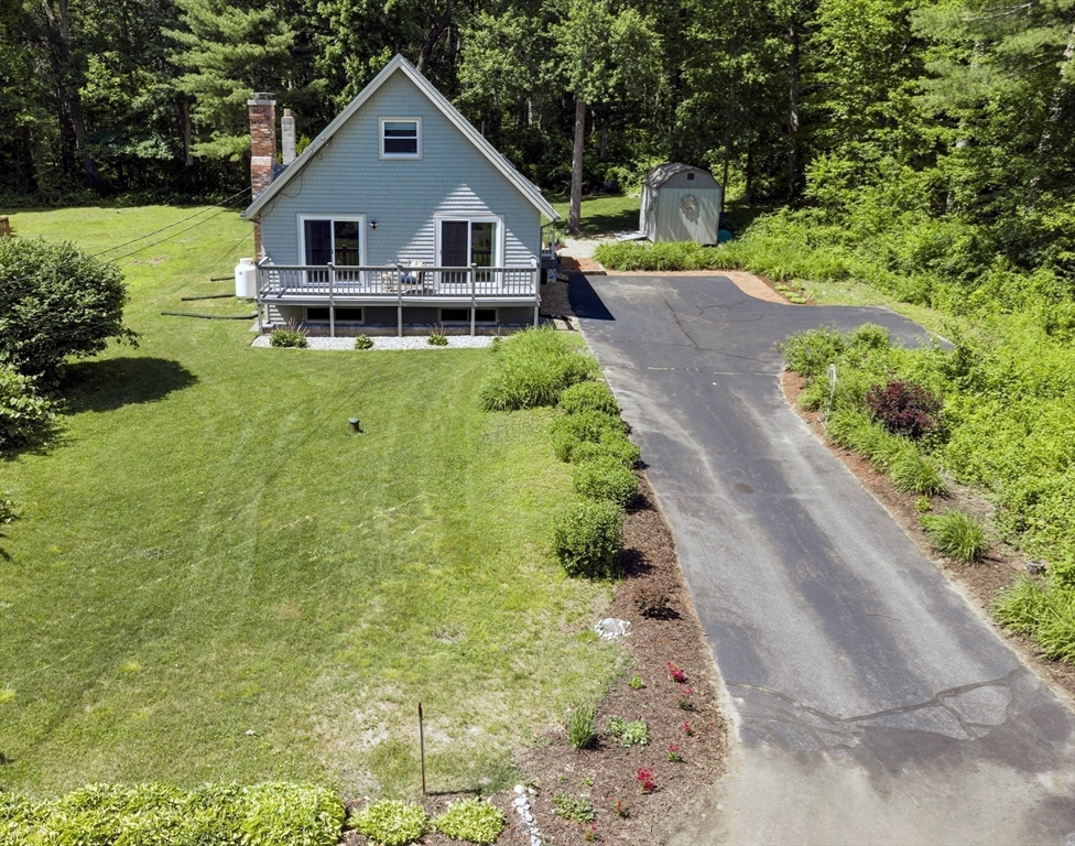 47 Horseshoe Circle Ware, MA 01082 - Photo 2 of 37 a house with green field in front of it