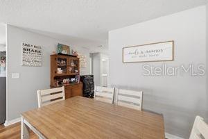 11014 Golden Warbler Road Brooksville, FL 34613 - Photo 12 of 50 a bedroom with a bed and furniture