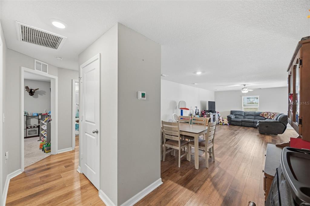 11014 Golden Warbler Road Brooksville, FL 34613 - Photo 29 of 50 a view of a dining room with furniture window and wooden floor