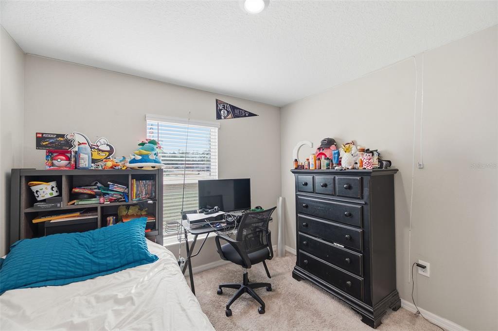 11014 Golden Warbler Road Brooksville, FL 34613 - Photo 32 of 50 a view of a workspace with furniture