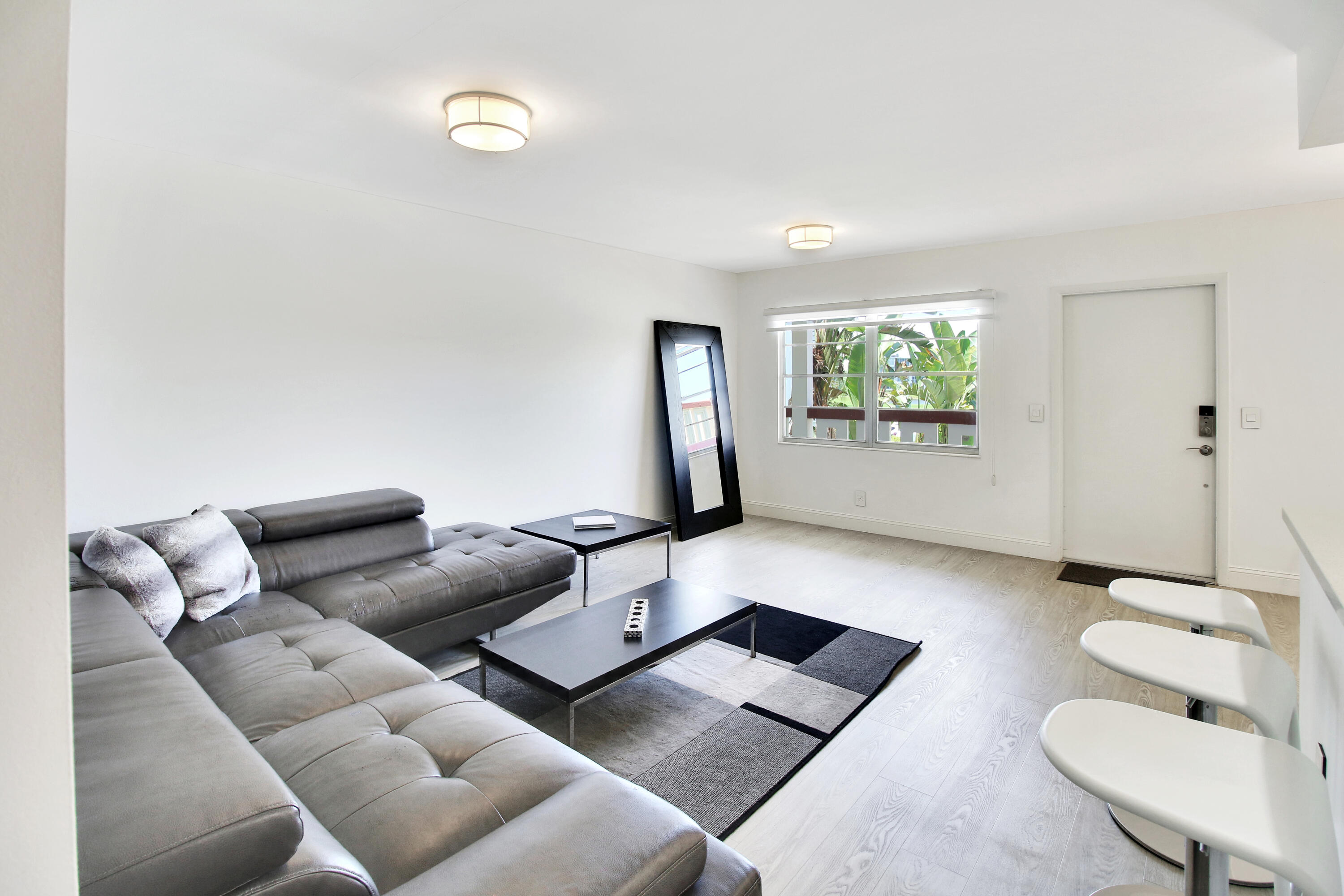 17 Fanshaw A Boca Raton, FL 33434 - Photo 3 of 11 a living room with furniture and a flat screen tv
