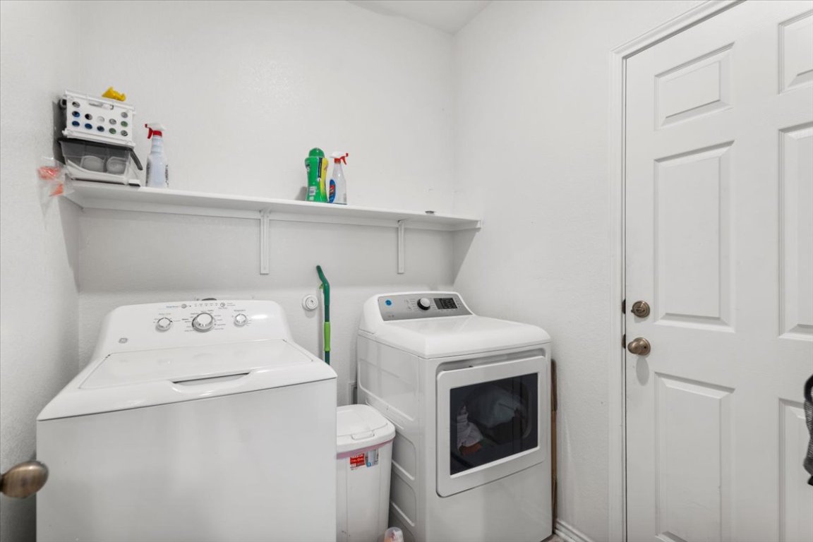 239 Crimson Lane Kyle, TX 78640 - Photo 12 of 25 a utility room with dryer and washer