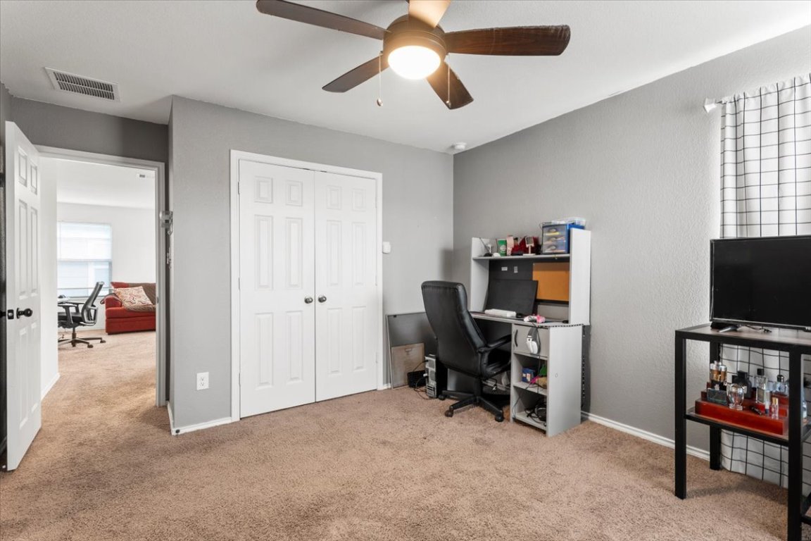 239 Crimson Lane Kyle, TX 78640 - Photo 17 of 25 a view of a livingroom with workspace and a window