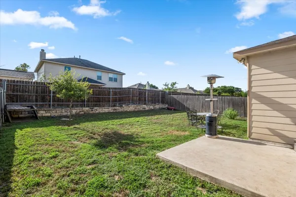 a view of a house with backyard and a slide