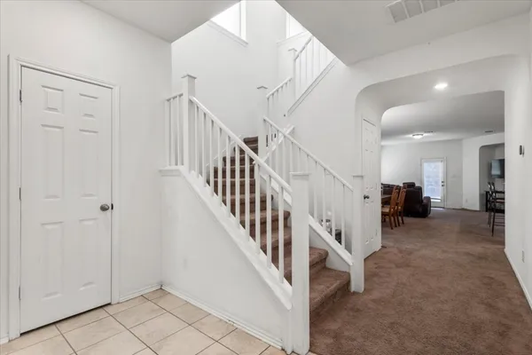 a view of a hallway with staircase