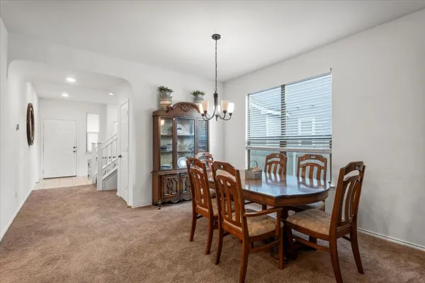 a view of a dining room with furniture window and outside view