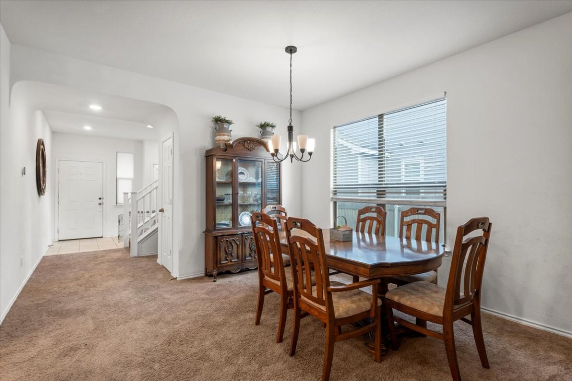 239 Crimson Lane Kyle, TX 78640 - Photo 6 of 25 a view of a dining room with furniture window and outside view