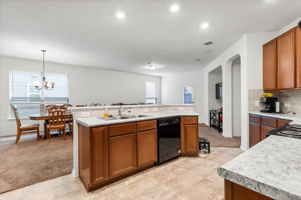 a kitchen that has a lot of cabinets in it