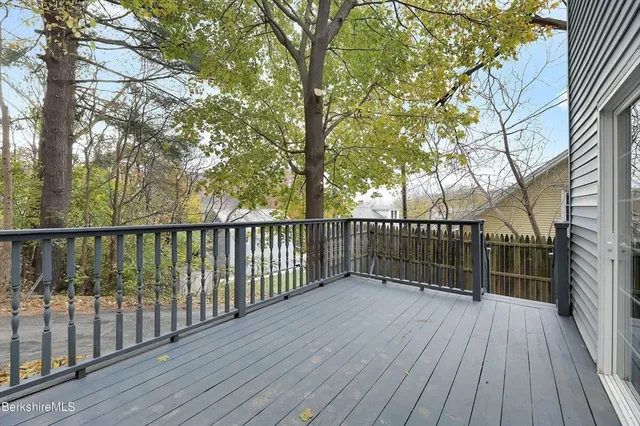 a view of deck with wooden floor and fence