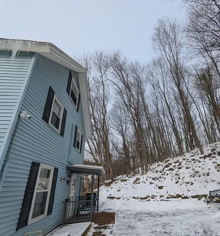 a view of a house with a snow