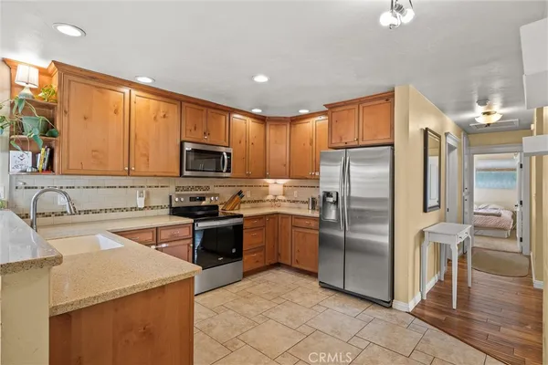 a kitchen with a refrigerator sink and microwave