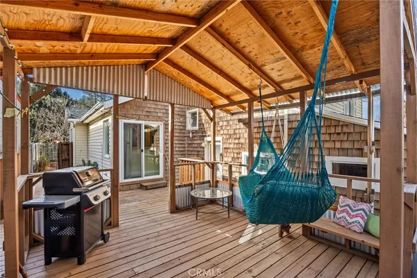 a view of balcony with couch and wooden floor
