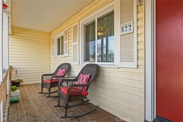 a view of a two chairs in the balcony