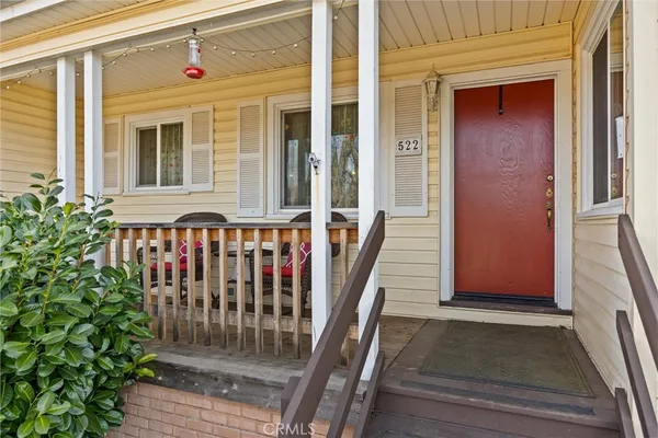 a front view of a house with a porch