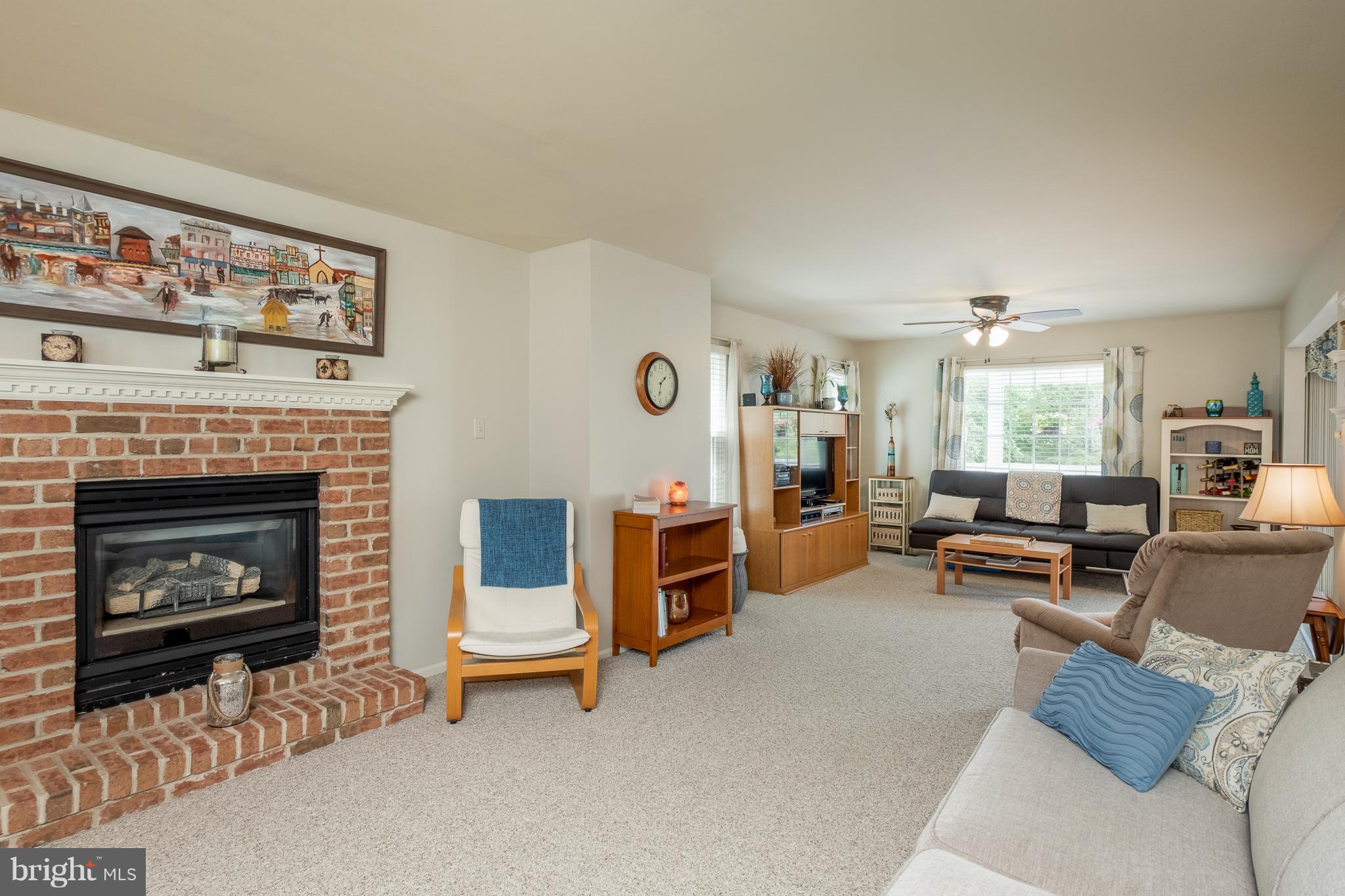 844 Sunny Chapel Road Odenton, MD 21113 - Photo 8 of 29 a living room with furniture and a fireplace