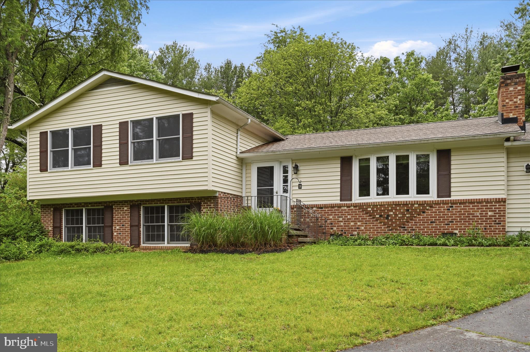 244 High Banks Road Stephenson, VA 22656 - Photo 2 of 45 a front view of a house with a garden
