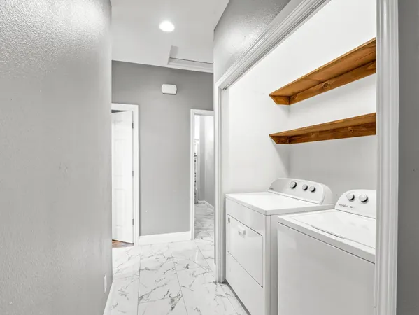 a utility room with dryer and washer