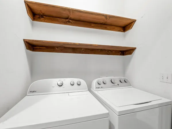 a utility room with dryer and washer