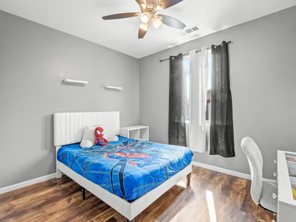 a bed room with a bed and a chandelier