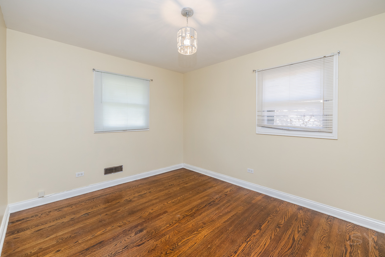14 Arrowhead Drive Thornton, IL 60476 - Photo 16 of 26 a view of an empty room with wooden floor and a window