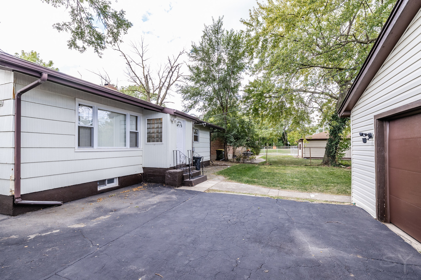 14 Arrowhead Drive Thornton, IL 60476 - Photo 24 of 26 a view of a house with backyard and trees