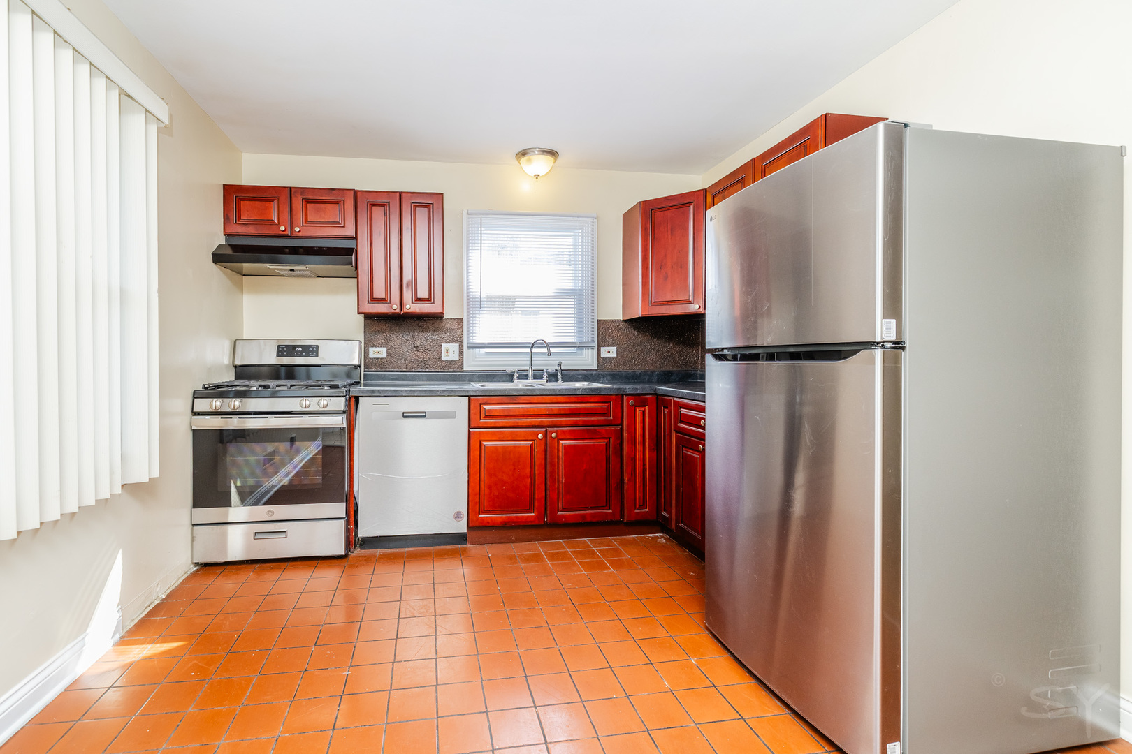 14 Arrowhead Drive Thornton, IL 60476 - Photo 6 of 26 a kitchen with stainless steel appliances a stove sink and refrigerator