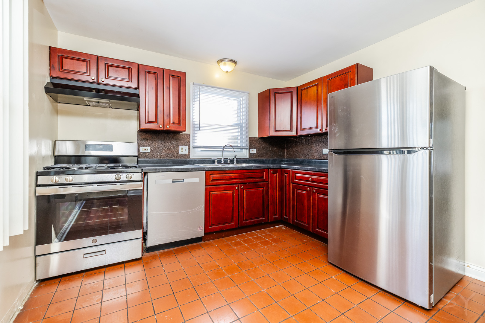 14 Arrowhead Drive Thornton, IL 60476 - Photo 7 of 26 a kitchen with stainless steel appliances granite countertop a stove a sink and a refrigerator