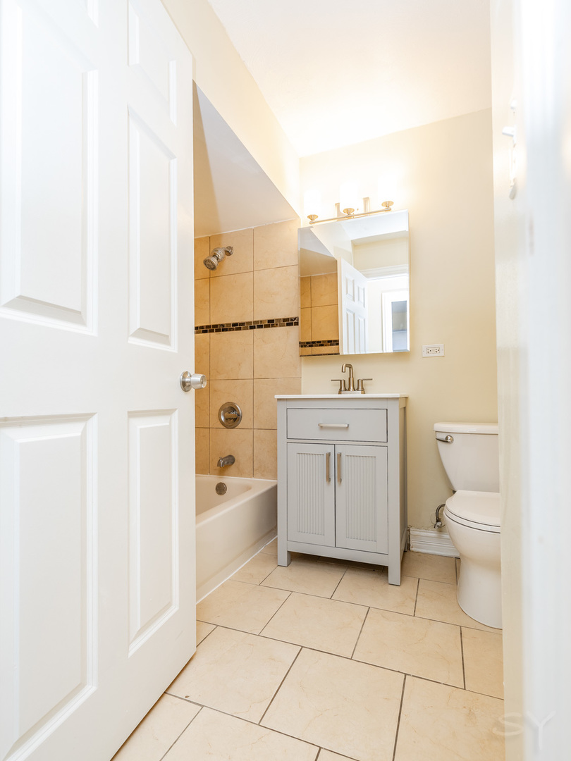 14 Arrowhead Drive Thornton, IL 60476 - Photo 10 of 26 a bathroom with a sink a toilet and shower