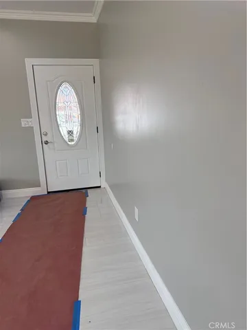 a view of a hallway with a door