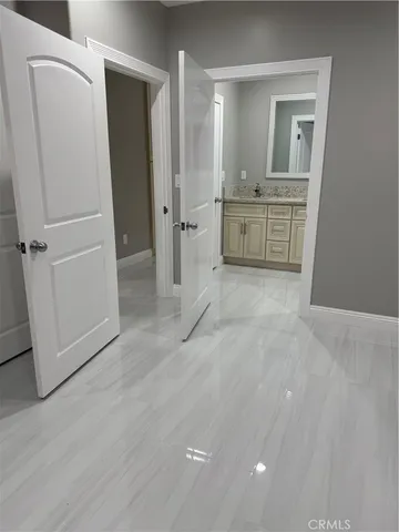wooden floor with white cabinets and wooden floor